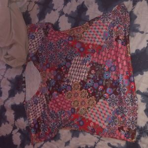 Women's shirt very colorful. Never been used before.